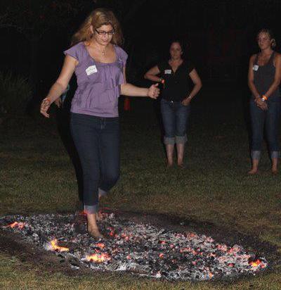 Jennifer walking on a bed of coals